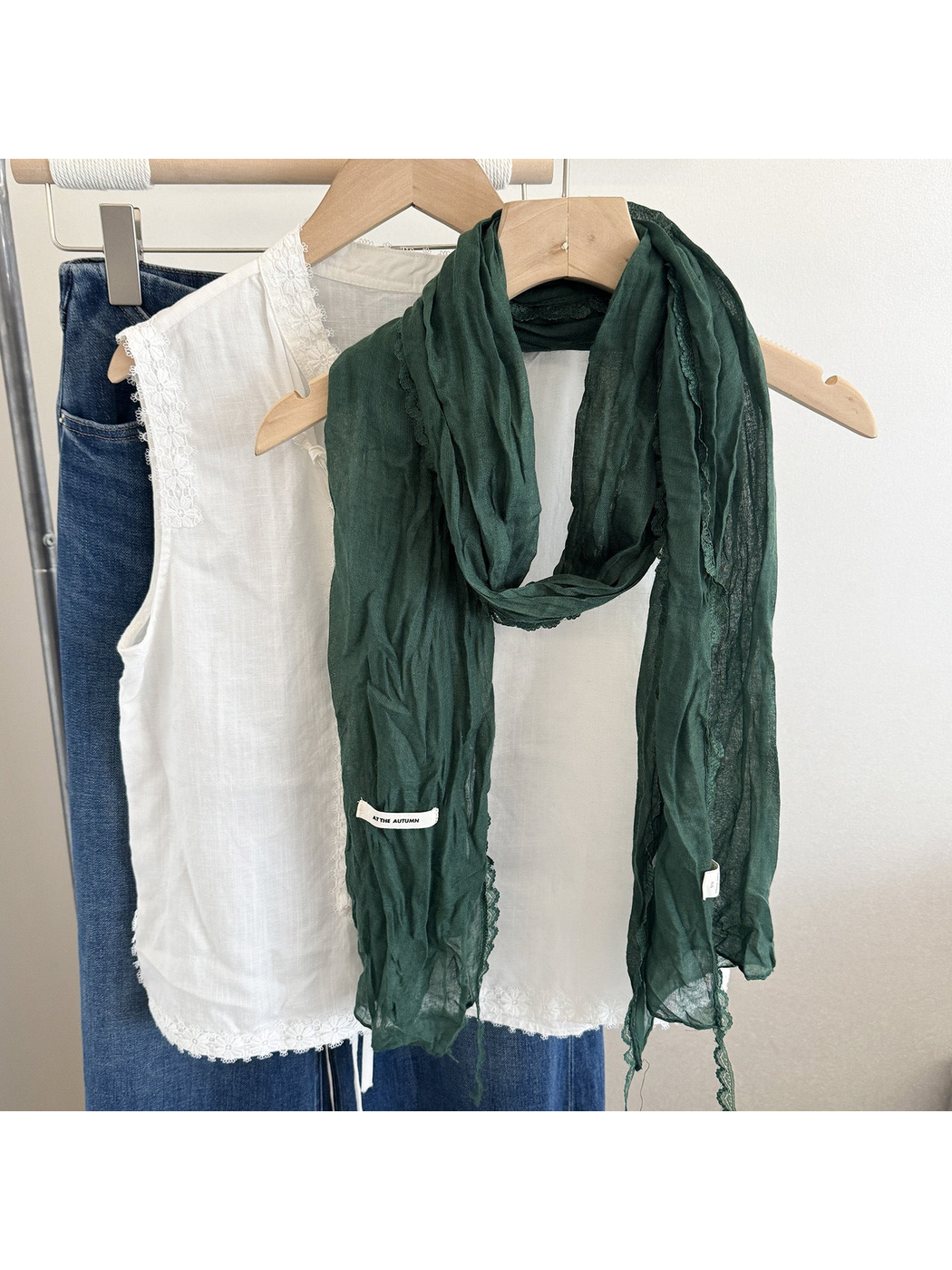 Dark green crinkled scarf with lace edging, front view