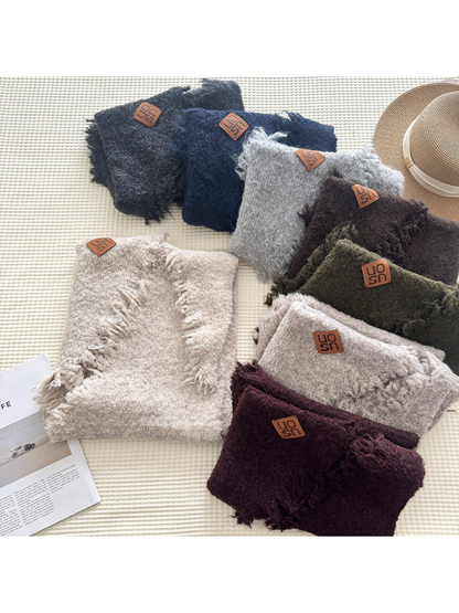 Multiple textured scarf colors arranged in a flat display