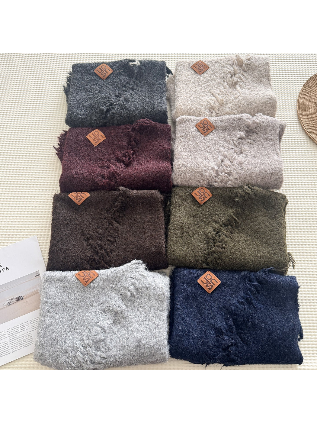 Multiple textured scarf colors arranged in a grid