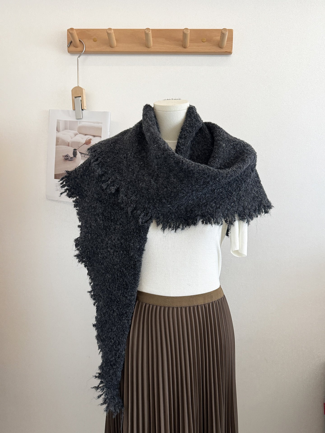 Dark Gray textured scarf with fringed edges draped on a mannequin