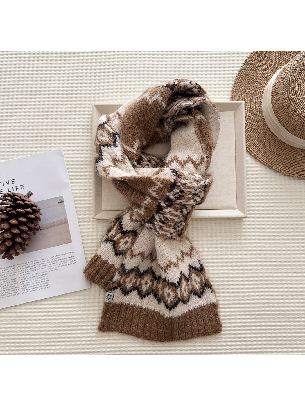 Camel patterned scarf in a looped display