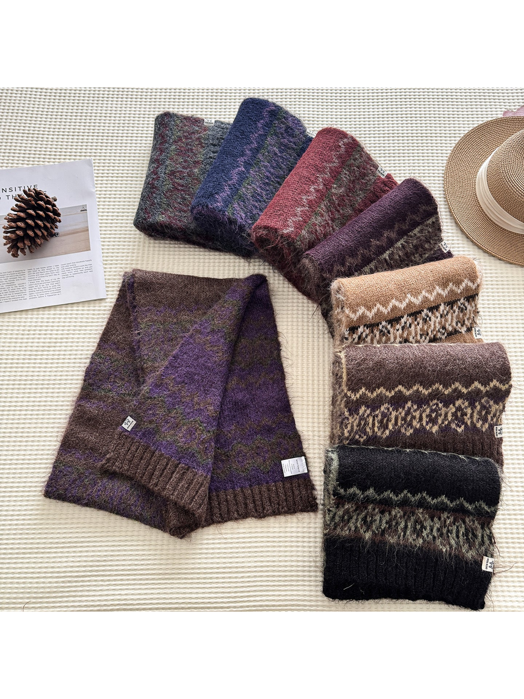 Patterned scarves in multiple colors arranged flat
