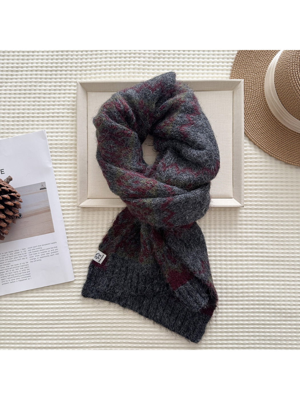 Gray patterned scarf in a looped display