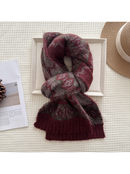 Burgundy patterned scarf in a looped display