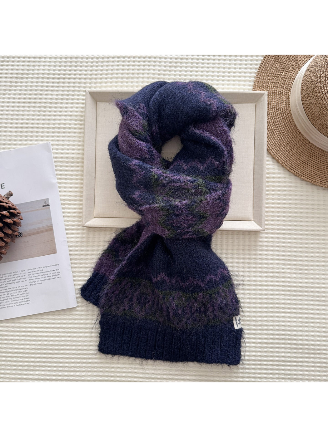 Navy patterned scarf in a looped display