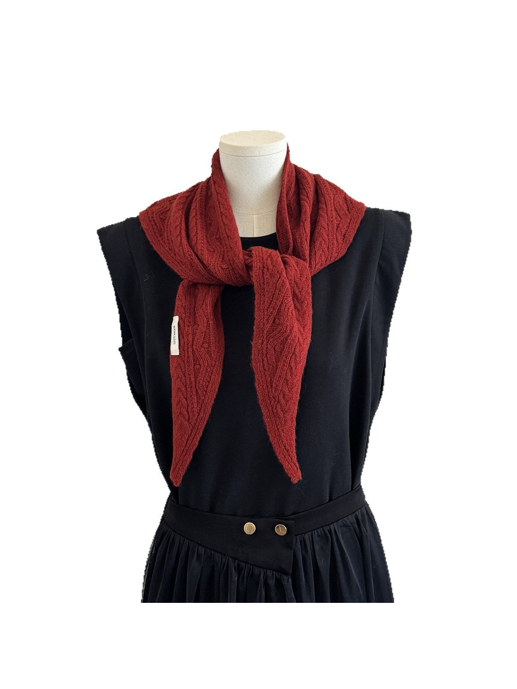 Burgundy textured triangle scarf tied around a mannequin