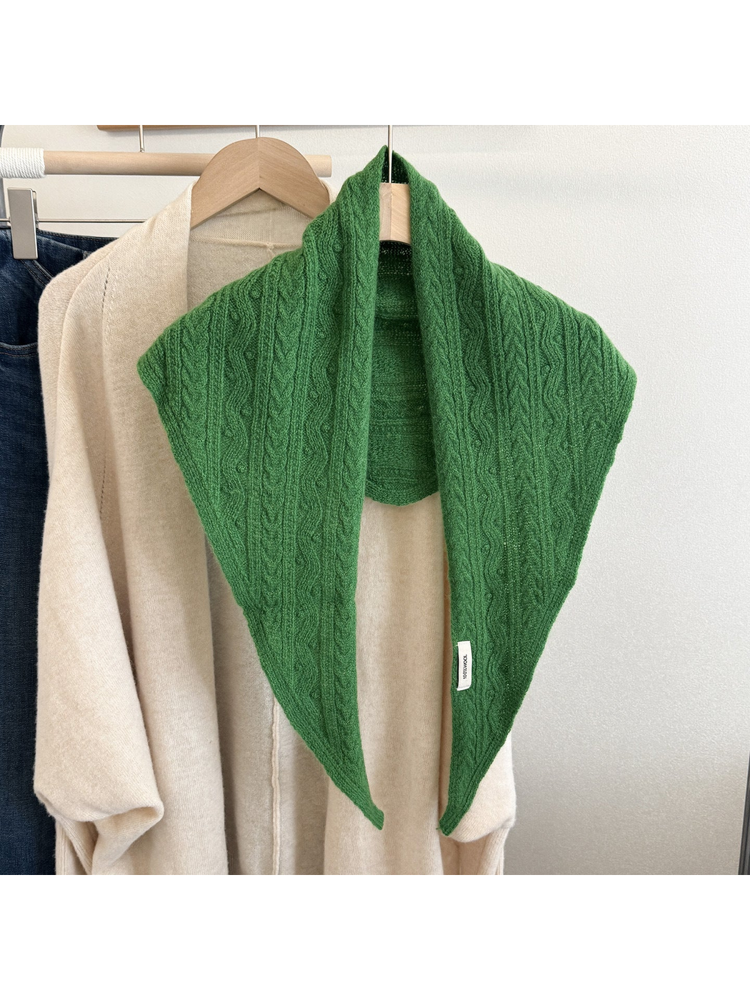 Green textured triangle scarf displayed front-facing