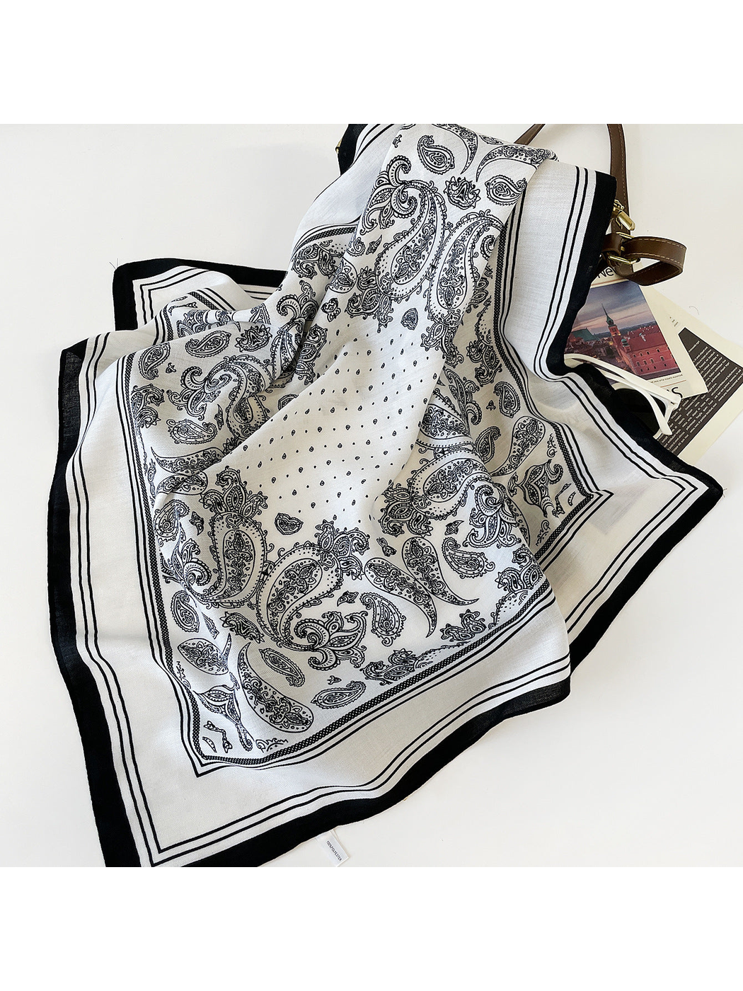 White paisley square scarf with striped border, draped view