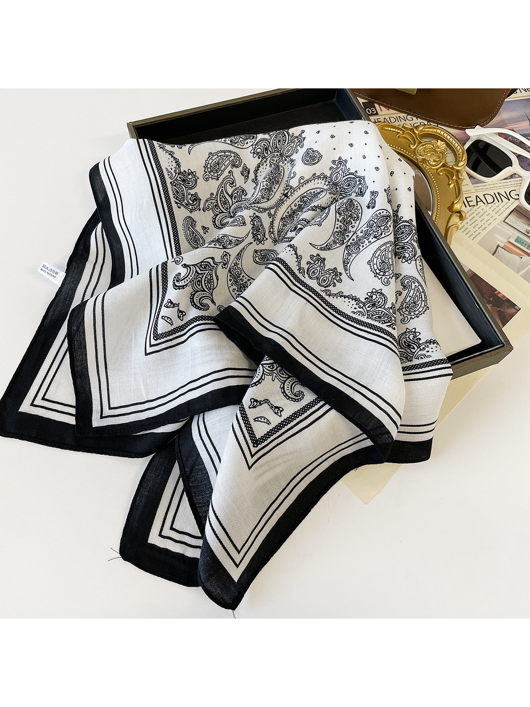 White paisley square scarf with striped border, folded display