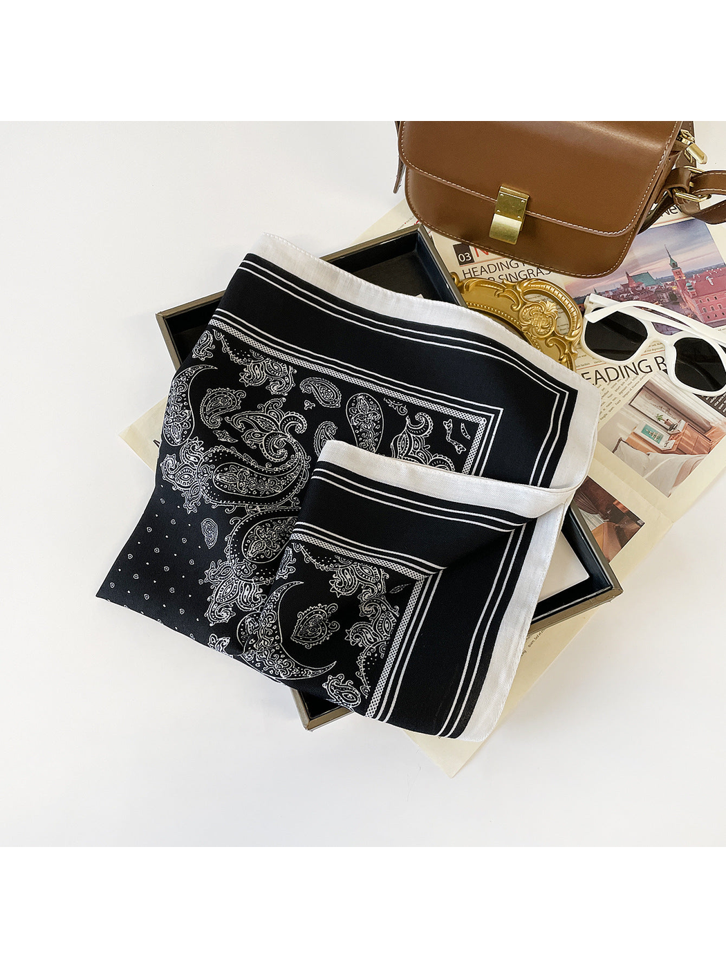 Black paisley square scarf with striped border, folded display