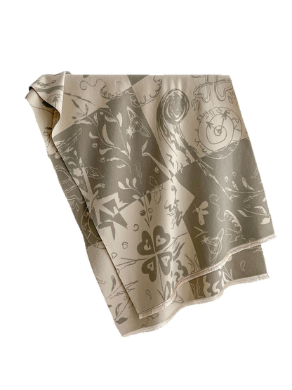 Rectangular scarf with an abstract botanical and celestial print and fringed edges