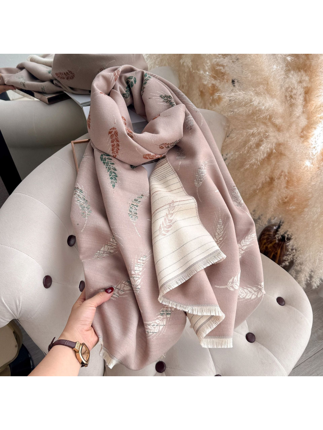 Blush Pink scarf held and draped over a chair with fringed edges