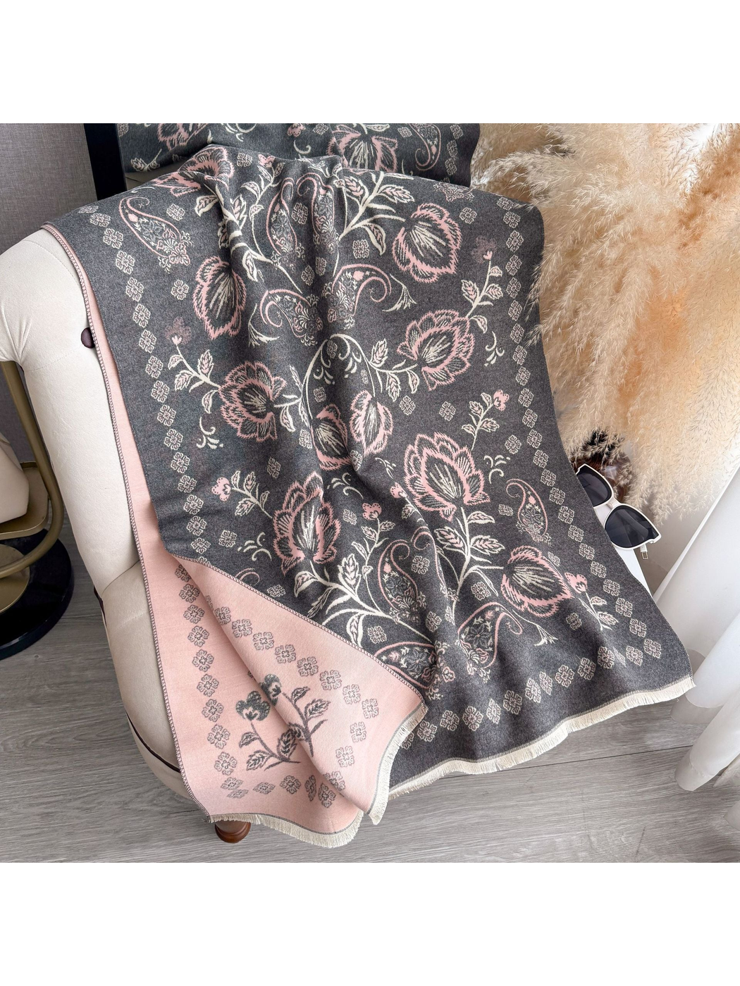 Dark Gray floral and paisley scarf draped over a chair, with a contrasting reverse side and fringed edges