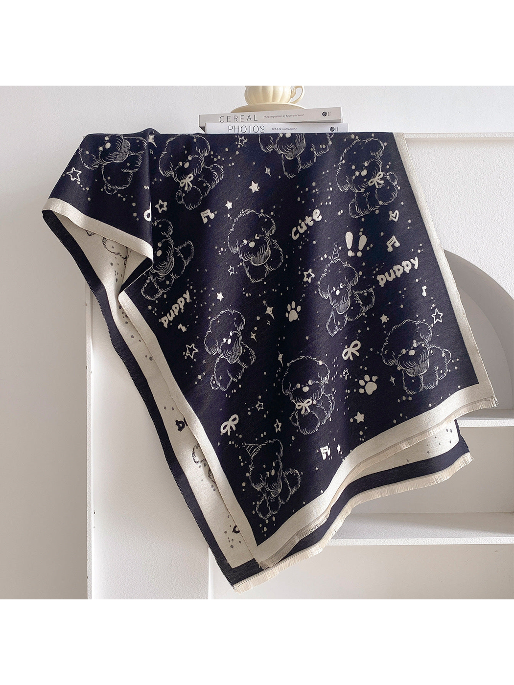 Navy rectangular scarf with teddy bears, stars, bows, music notes, paw prints, and fringed edges
