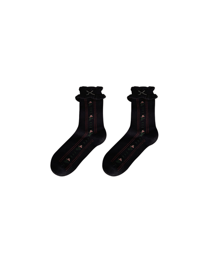Black socks with floral motifs, dotted stripes, and ruffled cuffs