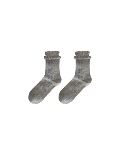 Light gray socks with floral motifs, dotted stripes, and ruffled cuffs
