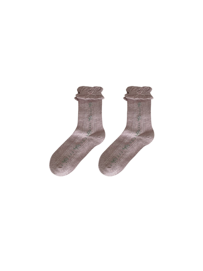 Light purple socks with floral motifs, dotted stripes, and ruffled cuffs