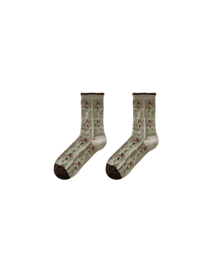 Mint socks with patchwork panels and small motifs