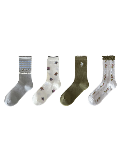 Four floral crew sock styles displayed on a white background
