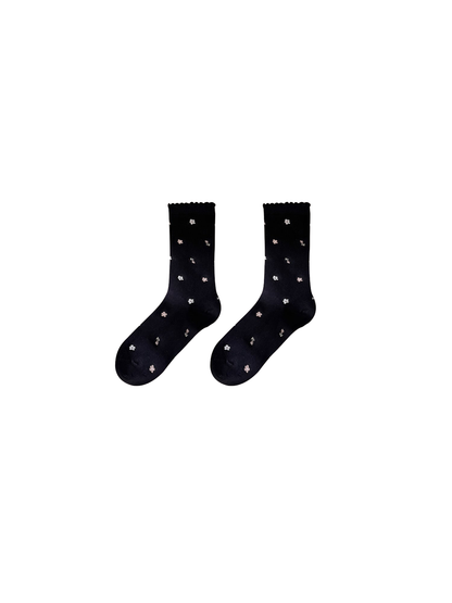 Black floral crew socks with scalloped ruffle cuffs, pair display