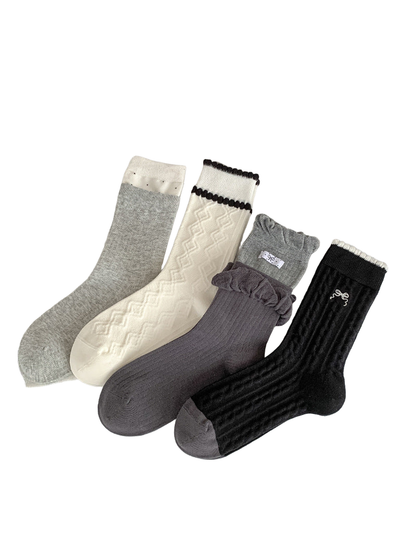 Four styles of crew socks displayed together on a tabletop