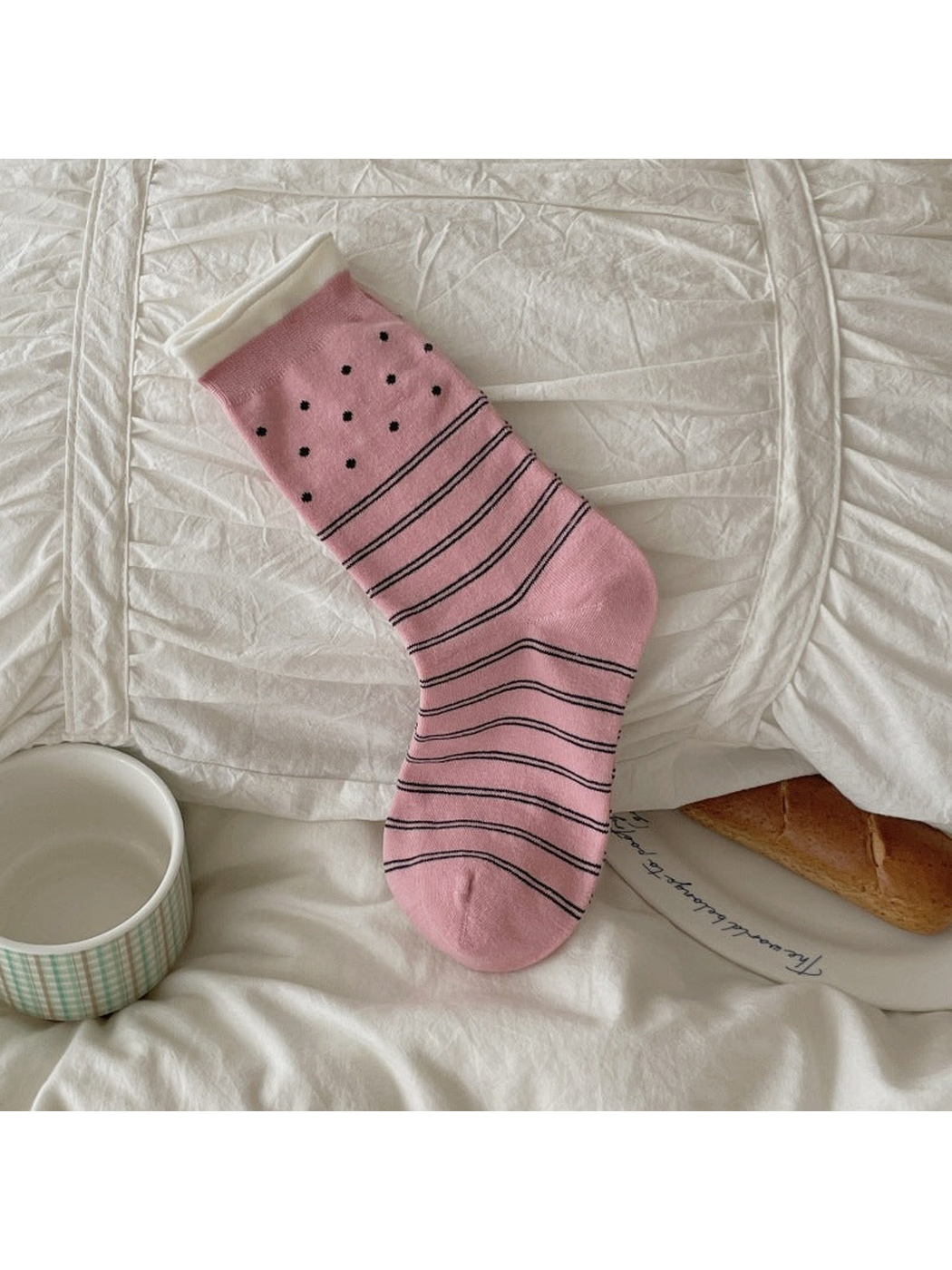 Pink crew sock with polka dots and horizontal stripes