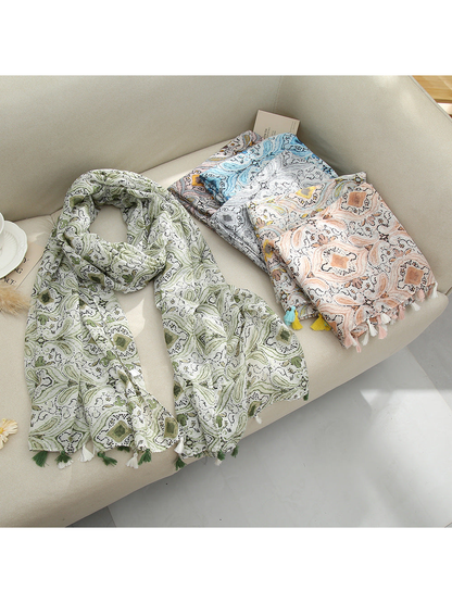 Green, light blue, and blush pink paisley scarves displayed together