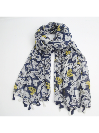Navy scarf arranged in a loop with tassel fringe