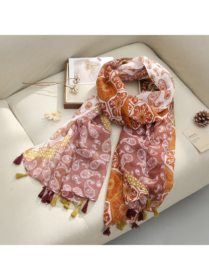 Brown Paisley scarf with paisley and floral patterns and tassel fringe, draped view