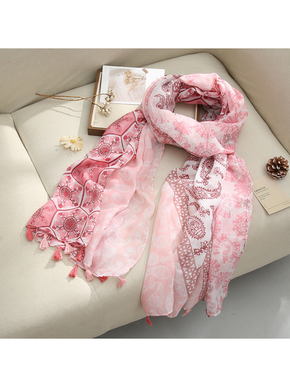 Pink Paisley scarf with paisley and floral patterns and tassel fringe, draped view
