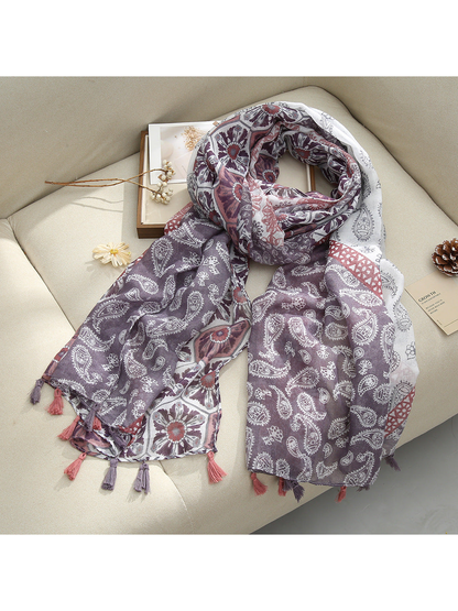 Purple Paisley scarf with paisley and floral patterns and tassel fringe, draped view