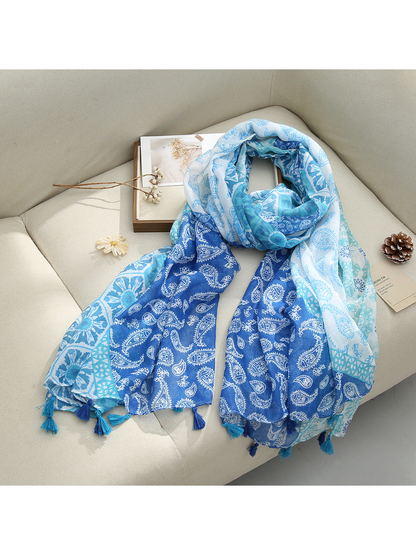 Blue Paisley scarf with paisley and floral patterns and tassel fringe, draped view
