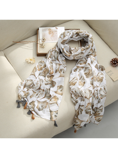 Beige Floral scarf with a floral pattern and tassel fringe, draped view