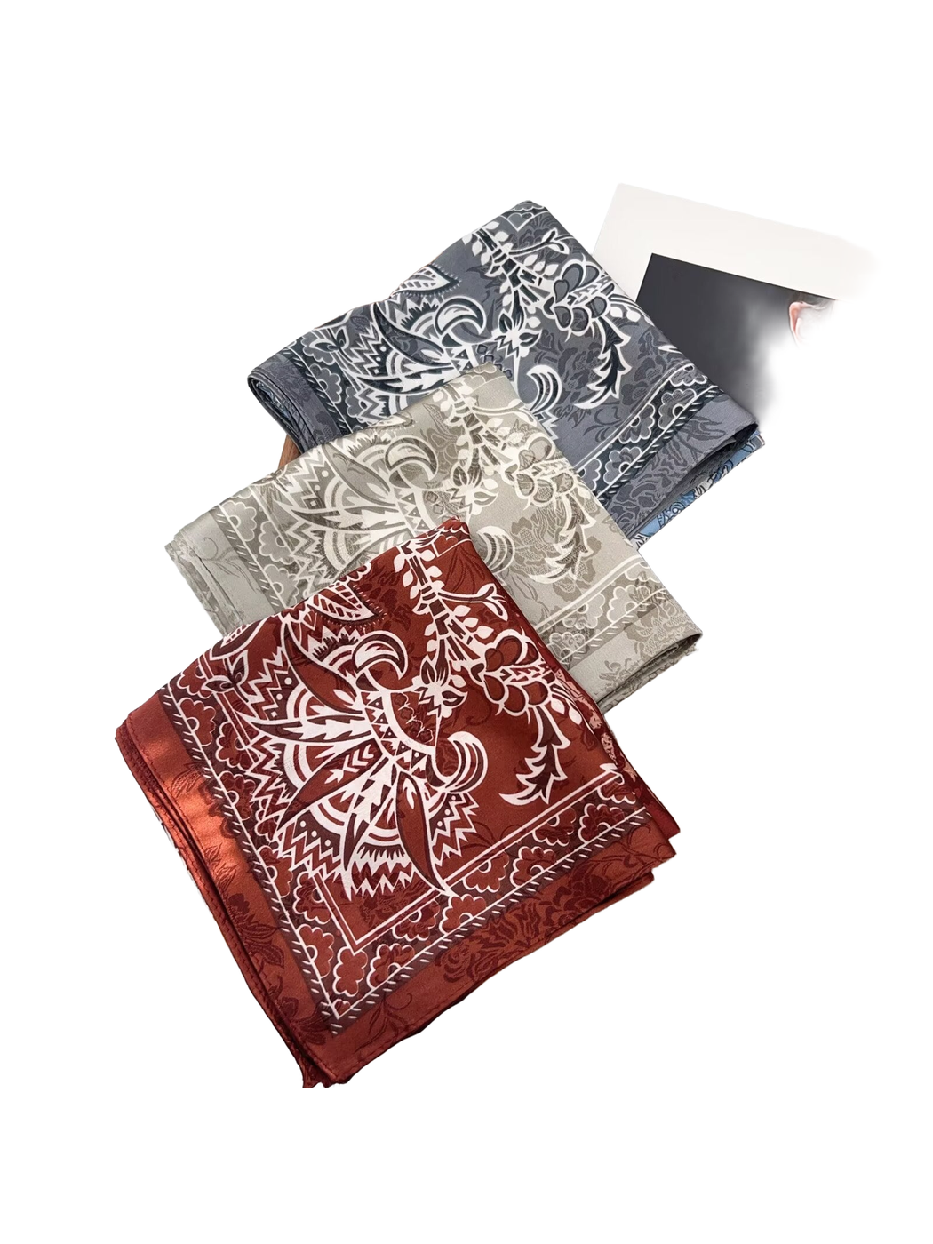 Burgundy, gray, and blue-gray patterned scarves displayed together