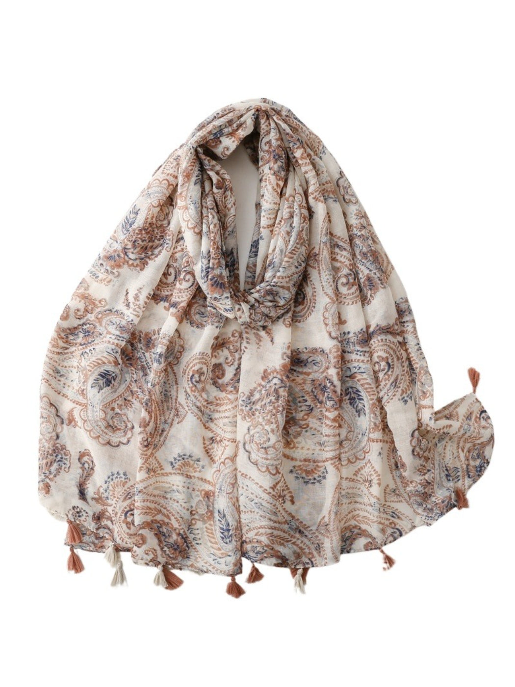 Scarvii Boho paisley shawl with tassels draped over a wooden chair