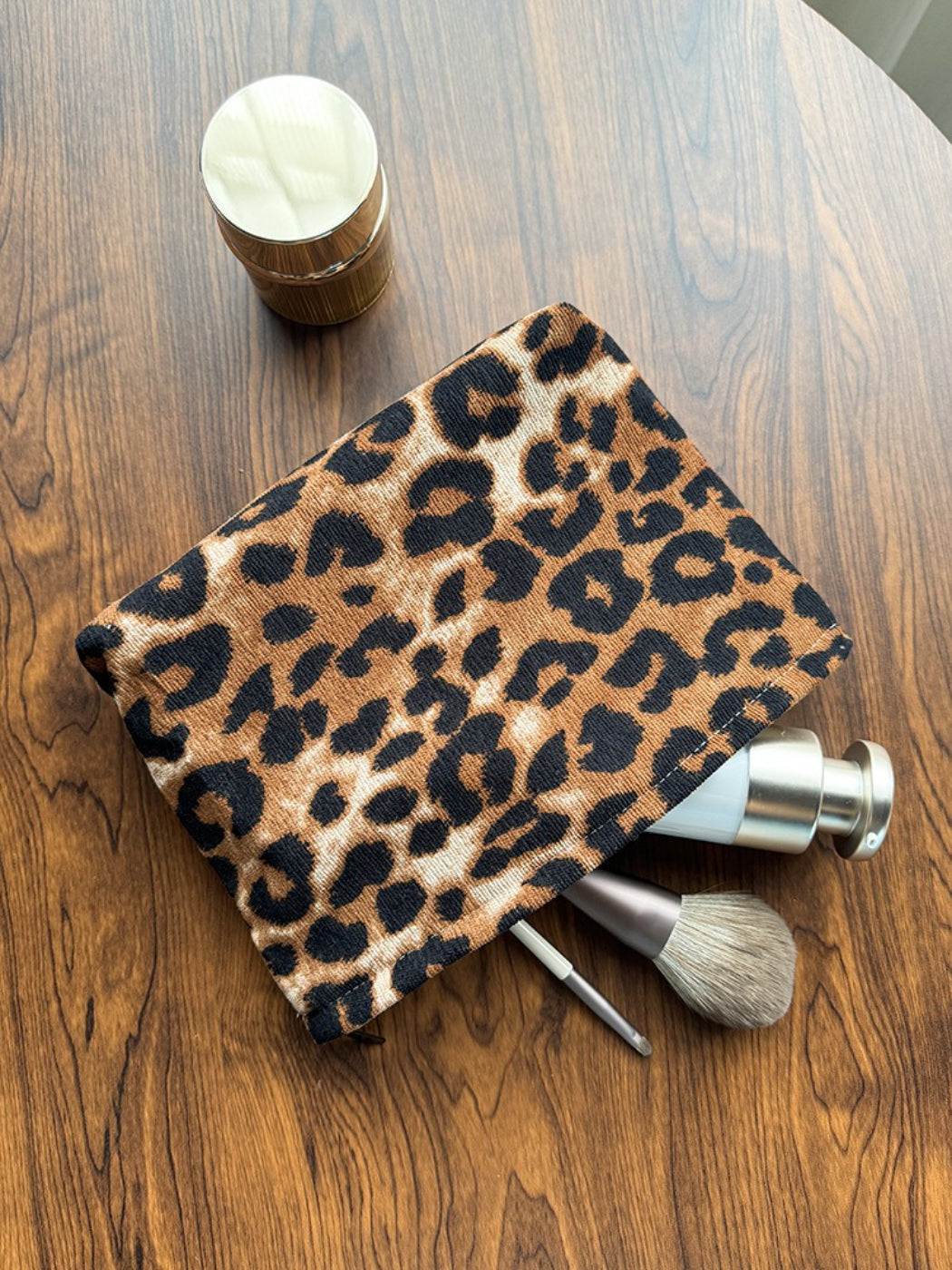 Cosbai flat pouch with leopard print folded flat on white background