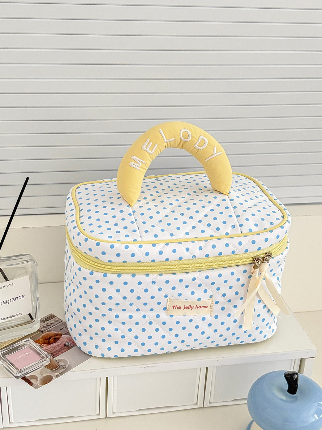 Cosbai polka dot quilted cosmetic case displayed standing upright with pattern visible