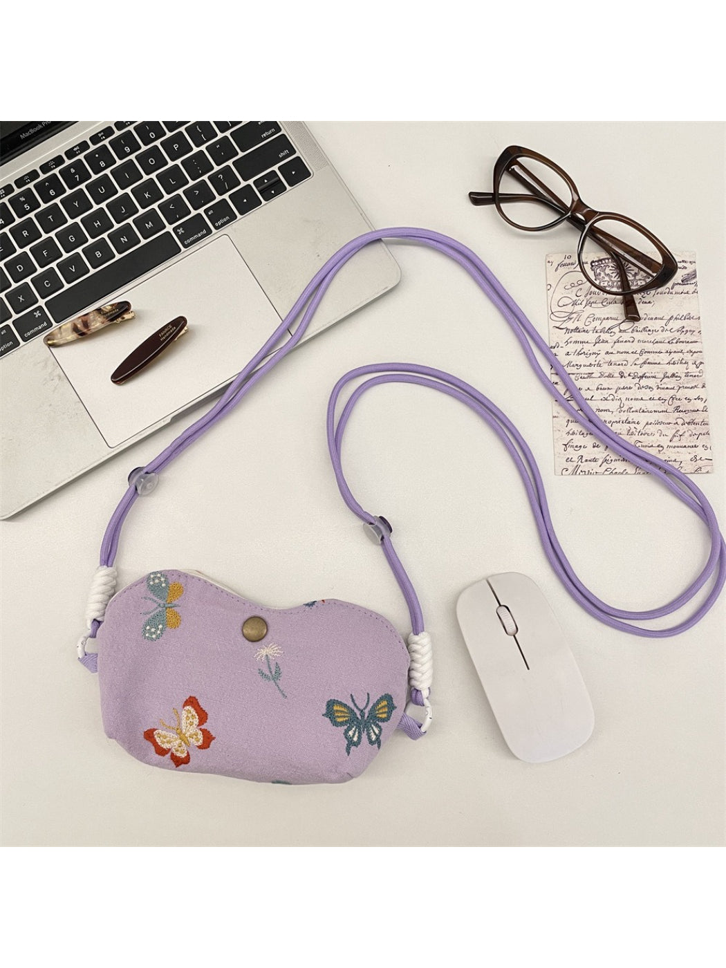 Close-up of floral embroidery detail on Cosbai mini crossbody pouch bag