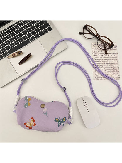 Close-up of floral embroidery detail on Cosbai mini crossbody pouch bag
