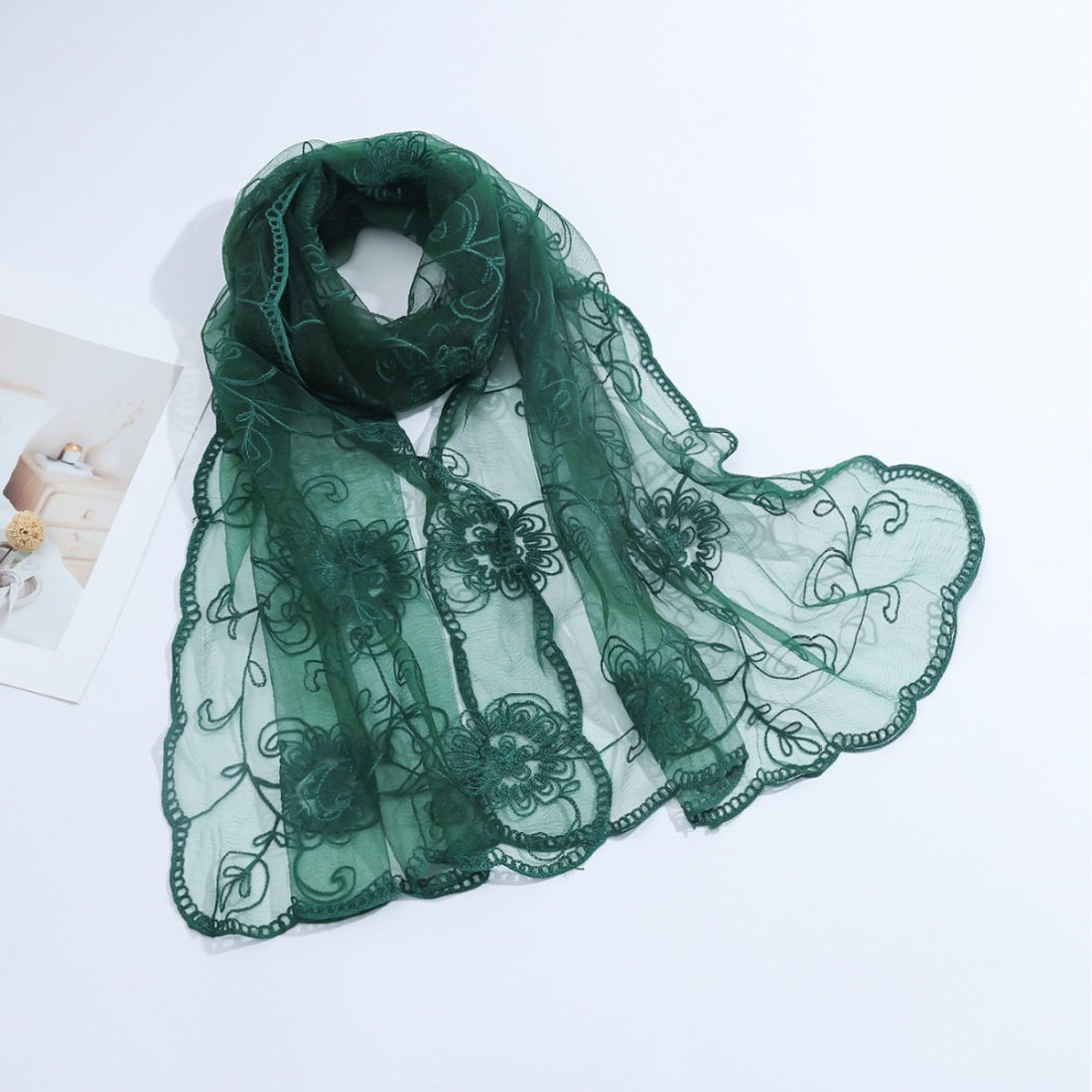 Model wearing Scarvii sheer floral mesh scarf styled around the neck