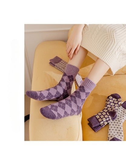 Rufia purple patterned crew socks styled on couch