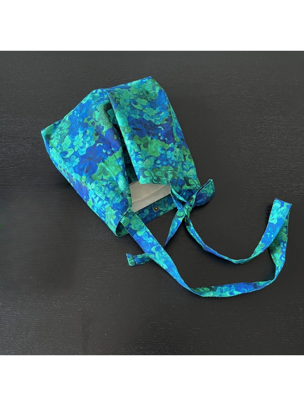 Cosbai blue floral tie shoulder bag with strap on white background