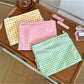 Cosbai Candy Check Makeup Bag with pastel checkered pattern on white background