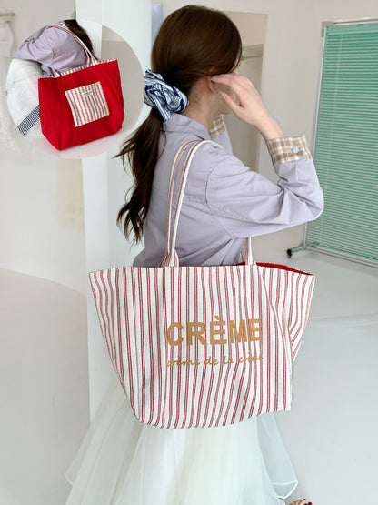 Cosbai tote bag folded to highlight reversible design and striped pattern