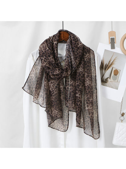 Scarf draped over a mannequin highlighting the leopard pattern