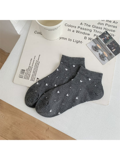 Rufia ankle socks worn on feet showing fit and mini heart pattern