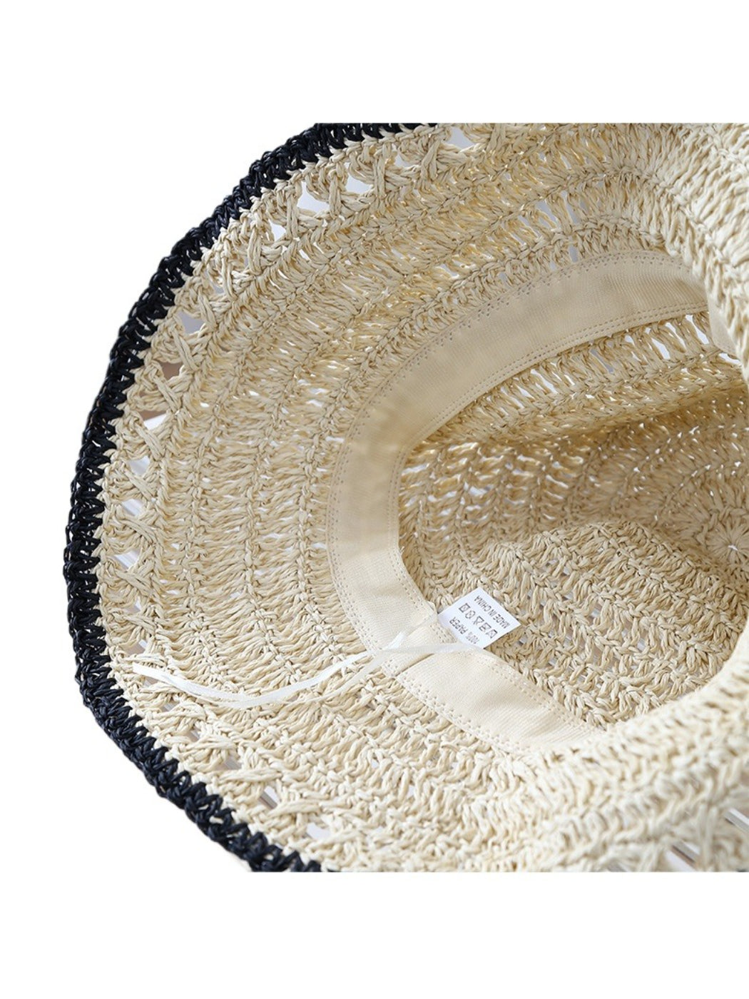 Top view of Haila lightweight crochet bucket hat highlighting crochet pattern and trim