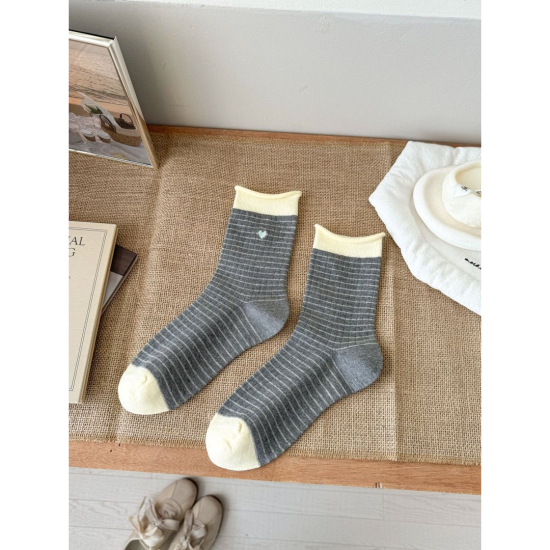 Side view of Rufia Everyday Stripe Heart Socks highlighting the striped cuff and heart motifs