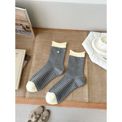 Side view of Rufia Everyday Stripe Heart Socks highlighting the striped cuff and heart motifs