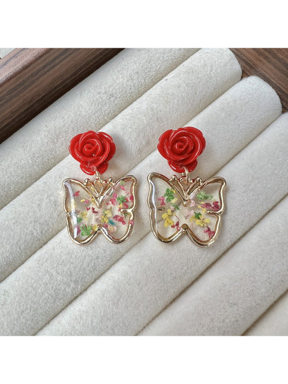 Detailed shot of Earwish Rose Butterfly Drop Earrings focusing on craftsmanship and colors